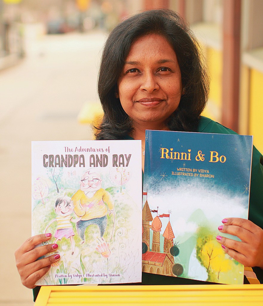 About Page Author Pic with her books